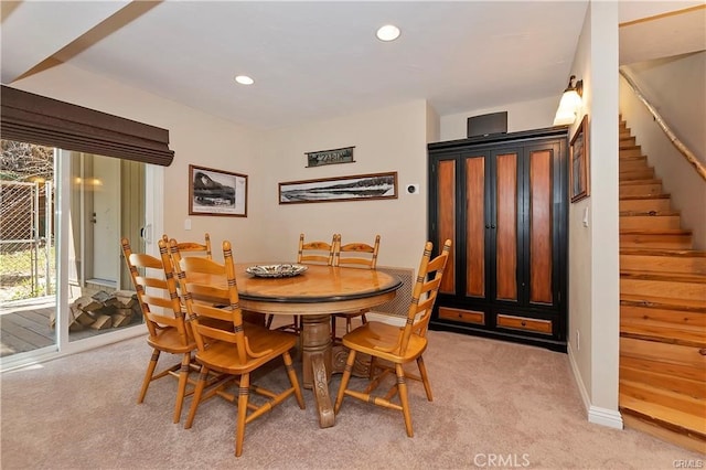 view of carpeted dining area