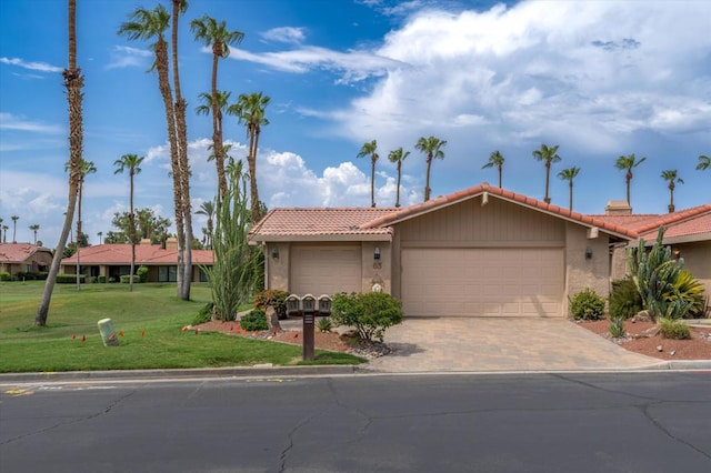 ranch-style house with a front lawn and a garage