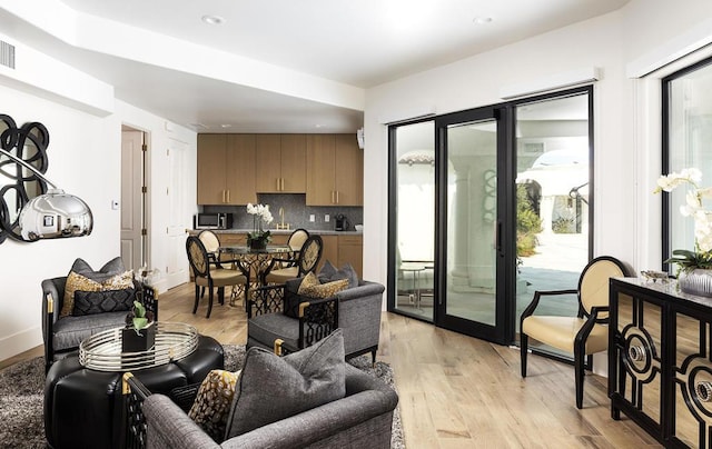 living room with light hardwood / wood-style flooring