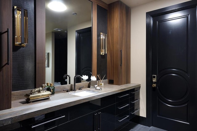 bathroom with tile patterned flooring and vanity