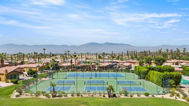 view of tennis court with a mountain view