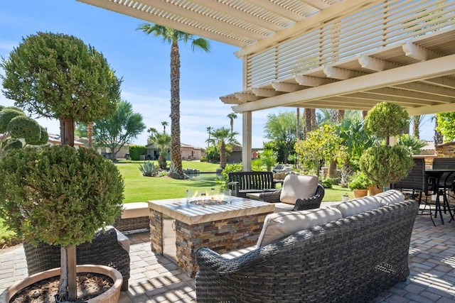 view of patio / terrace with an outdoor living space with a fire pit and a pergola