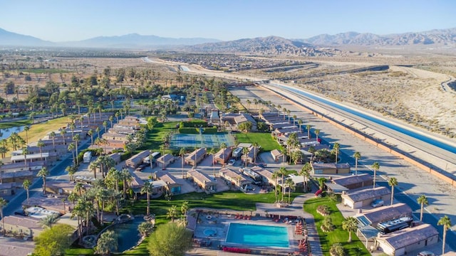 birds eye view of property with a mountain view