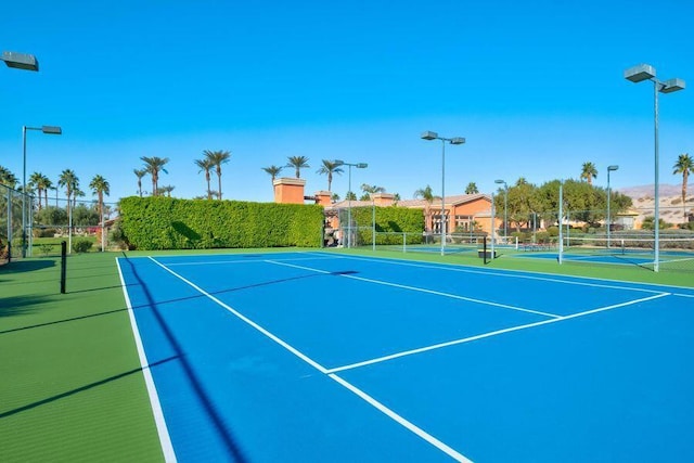 view of sport court with basketball hoop