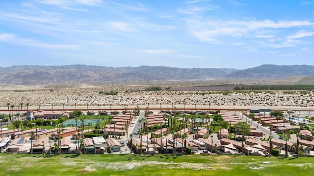 birds eye view of property featuring a mountain view