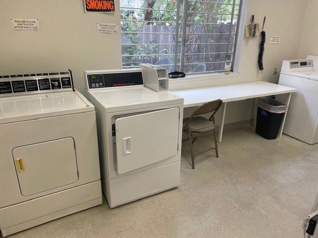 washroom featuring washer and dryer