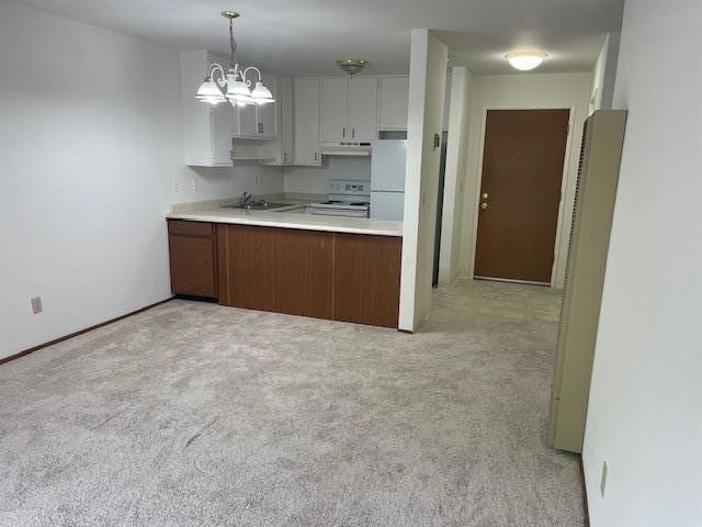 kitchen with pendant lighting, sink, white cabinets, light colored carpet, and white appliances