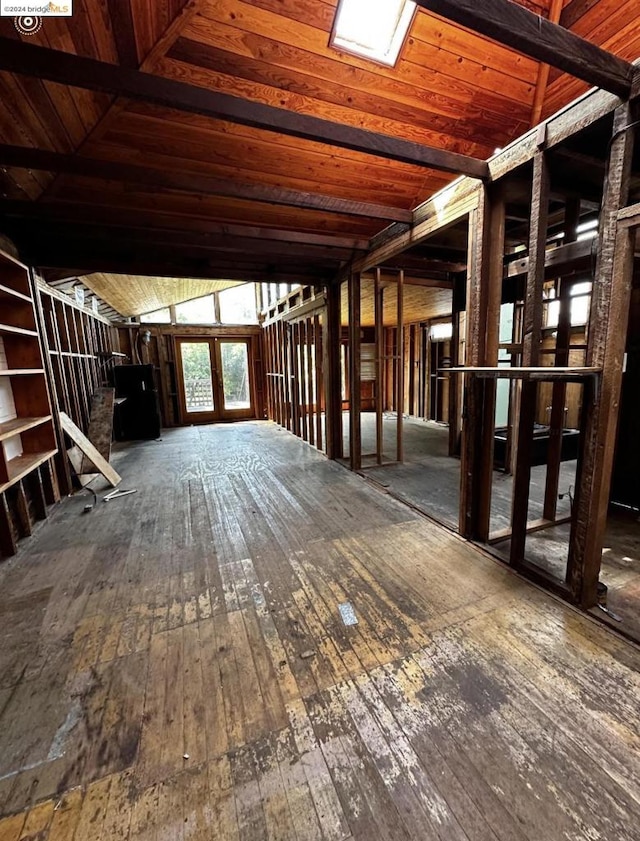 misc room featuring wood-type flooring, wooden ceiling, and lofted ceiling with skylight