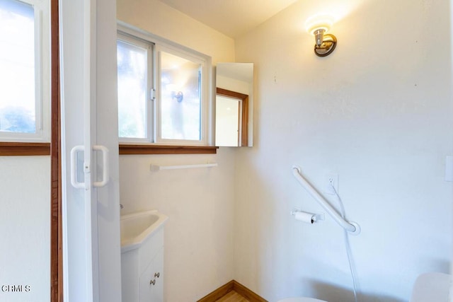 bathroom with plenty of natural light and vanity