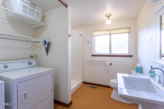 laundry area featuring washer / dryer and sink