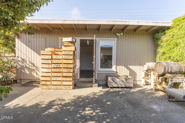 property entrance featuring a patio area