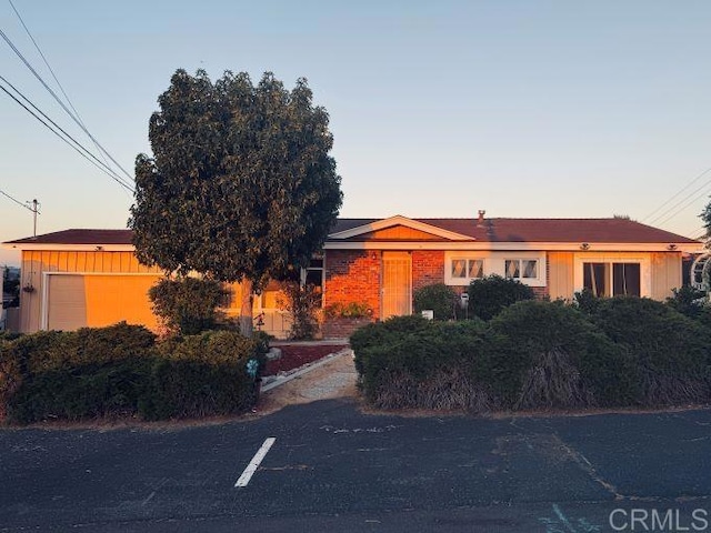 ranch-style house featuring a garage