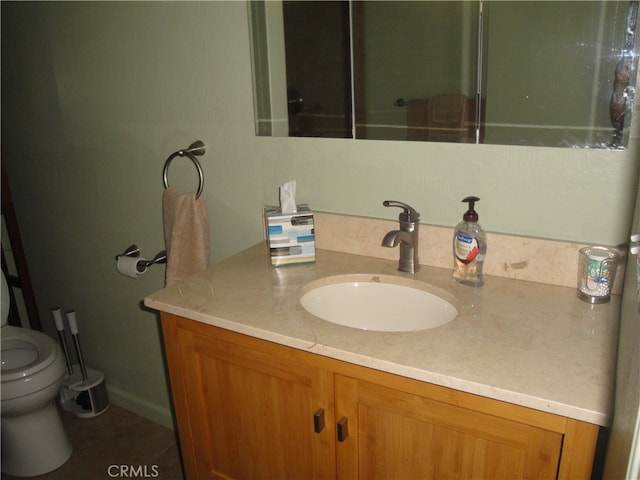 bathroom featuring vanity and toilet