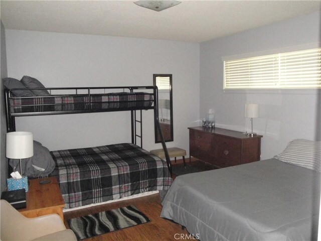 bedroom featuring dark hardwood / wood-style floors