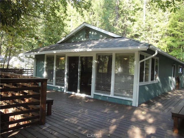 wooden terrace featuring a sunroom