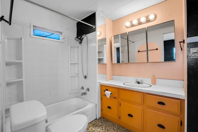 full bathroom featuring tiled shower / bath, vanity, and toilet