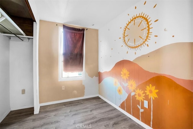 unfurnished bedroom featuring wood-type flooring