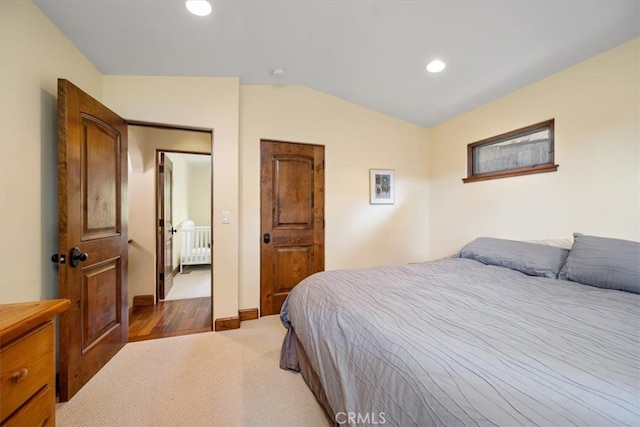 bedroom with radiator, lofted ceiling, and carpet flooring