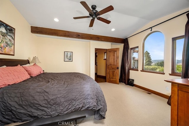 bedroom featuring ceiling fan, light carpet, and vaulted ceiling