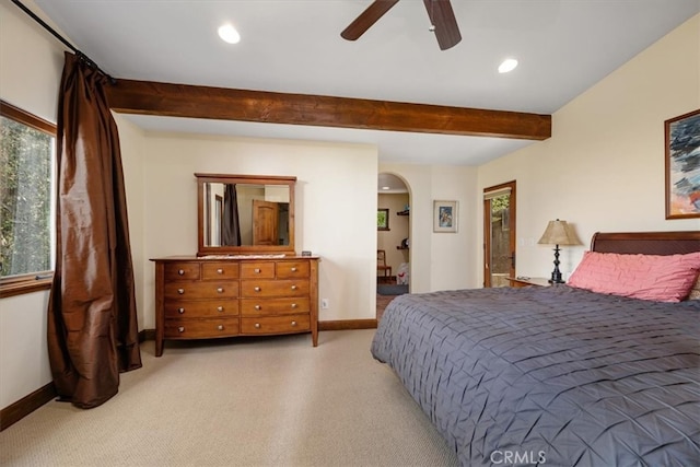 bedroom with light carpet, beam ceiling, and ceiling fan