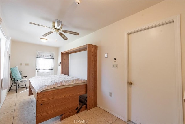 bedroom featuring ceiling fan and light tile patterned floors