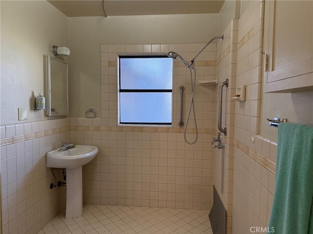 bathroom with tile walls and tiled shower