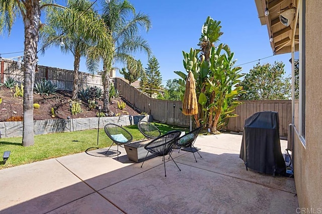 view of patio / terrace featuring a fenced backyard and a grill