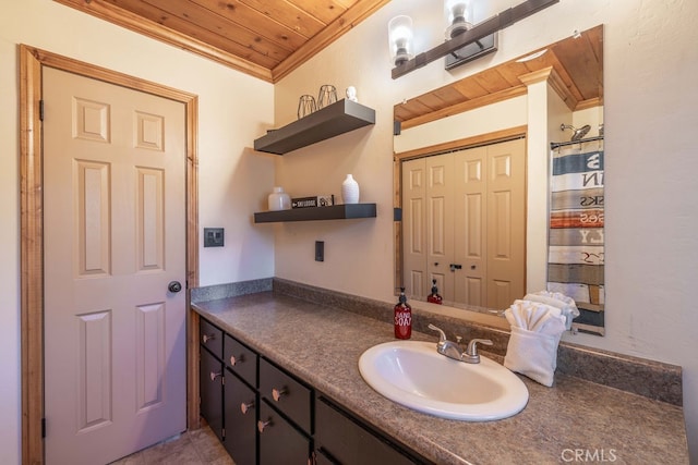 bathroom with ornamental molding, wooden ceiling, and vanity