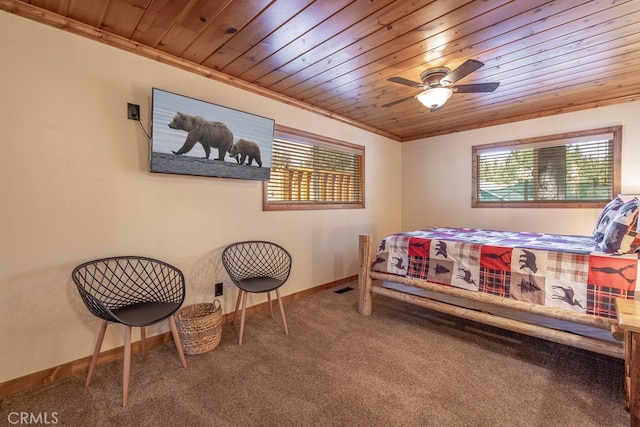 bedroom featuring ornamental molding, carpet, ceiling fan, and wooden ceiling