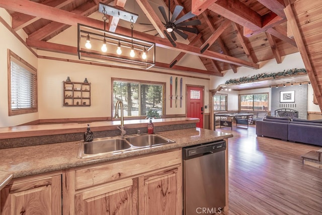 kitchen with wood-type flooring, dishwasher, sink, vaulted ceiling with beams, and light brown cabinetry