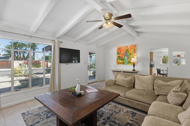 tiled living room featuring vaulted ceiling with beams, ceiling fan, and a healthy amount of sunlight