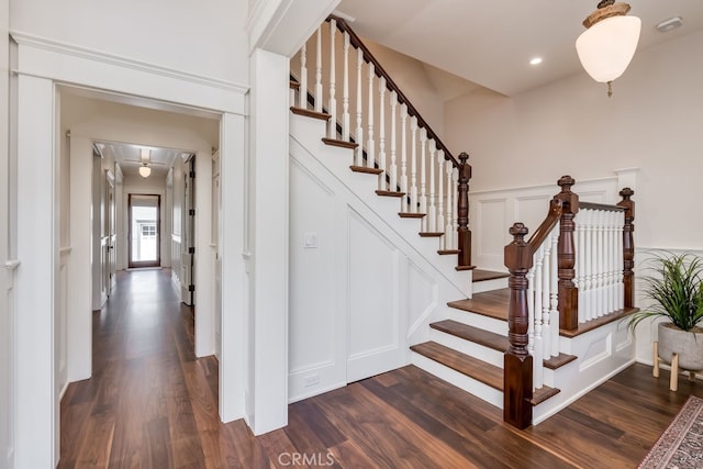 stairs with wood-type flooring