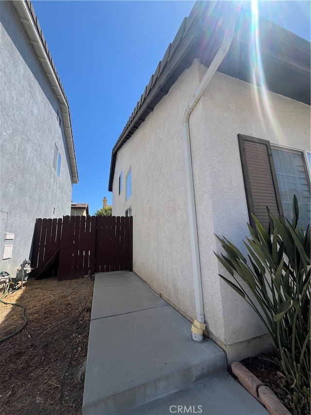 view of side of home with a patio area