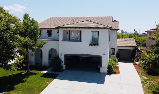 mediterranean / spanish-style home featuring a front lawn