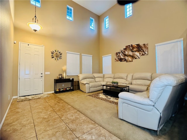 tiled living room featuring a high ceiling