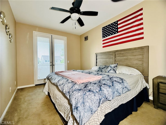 carpeted bedroom featuring ceiling fan and access to exterior