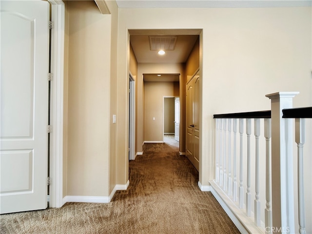 hallway featuring carpet