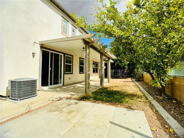 exterior space with a patio and central AC