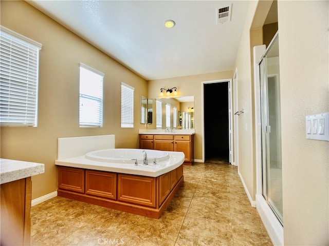 bathroom with vanity, separate shower and tub, and tile patterned flooring