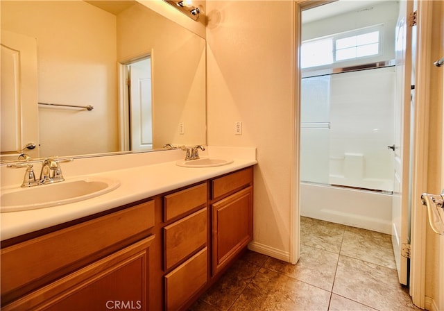 bathroom with vanity, enclosed tub / shower combo, and tile patterned floors