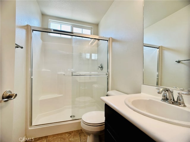 bathroom featuring a textured ceiling, a shower with shower door, toilet, tile patterned floors, and vanity