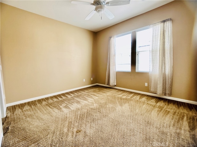 empty room with carpet and ceiling fan