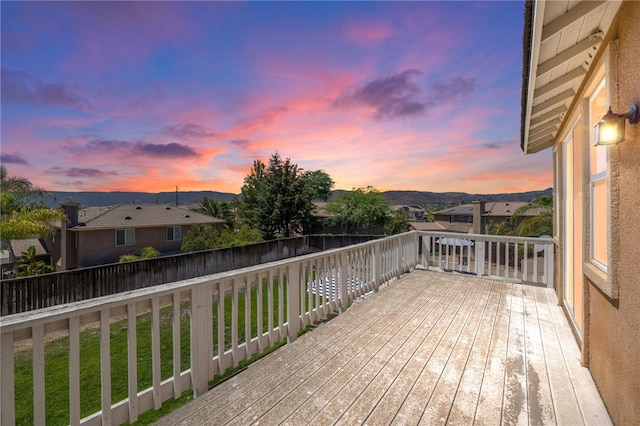 deck at dusk with a yard