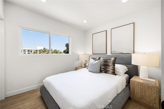 bedroom with light hardwood / wood-style floors