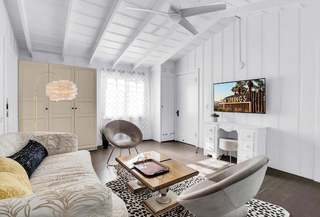 living room featuring vaulted ceiling with beams, dark hardwood / wood-style floors, and ceiling fan