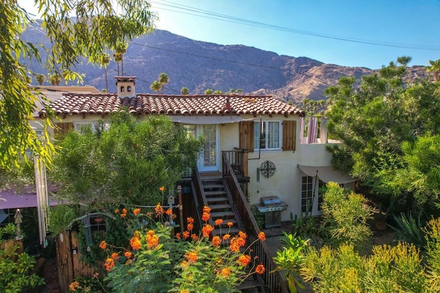 view of front of home with a mountain view