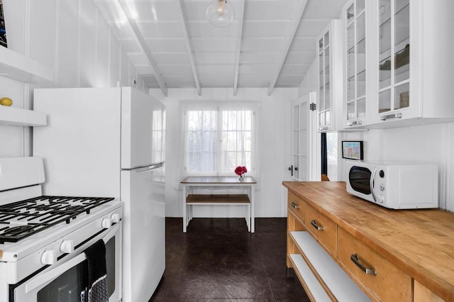 kitchen with wood counters, white appliances, exhaust hood, vaulted ceiling with beams, and white cabinetry