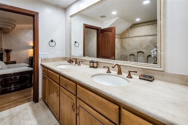 bathroom featuring vanity, tile patterned floors, and a shower with shower door