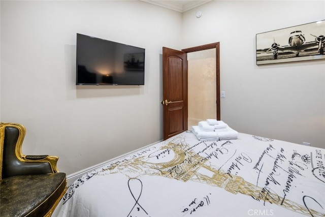 bedroom with crown molding