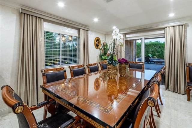 tiled dining room with ornamental molding